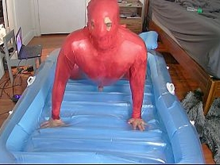 Inflatable oil catsuit fuck